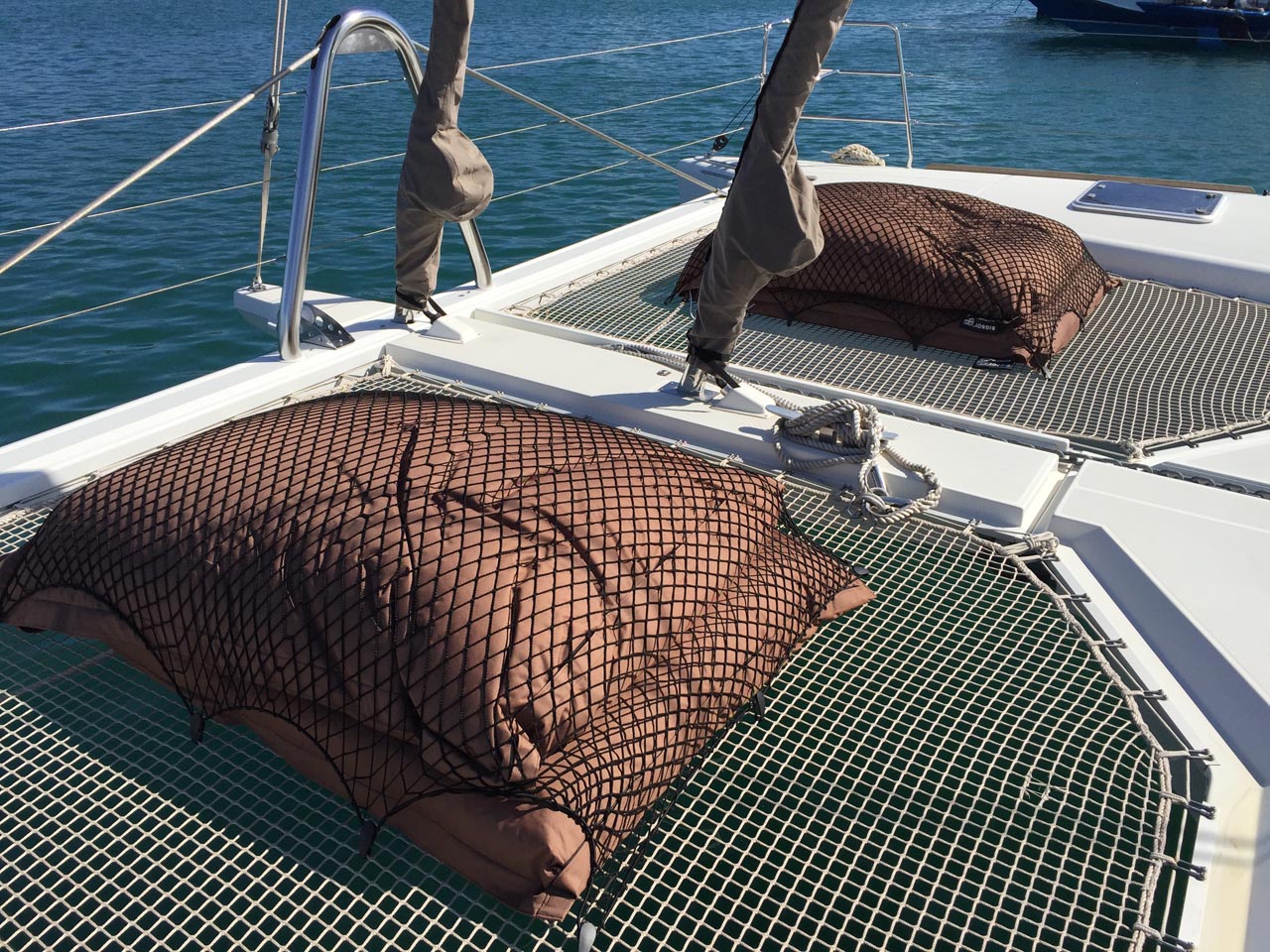 Bespoke elasticated nets for covering cushions on a boat deck.