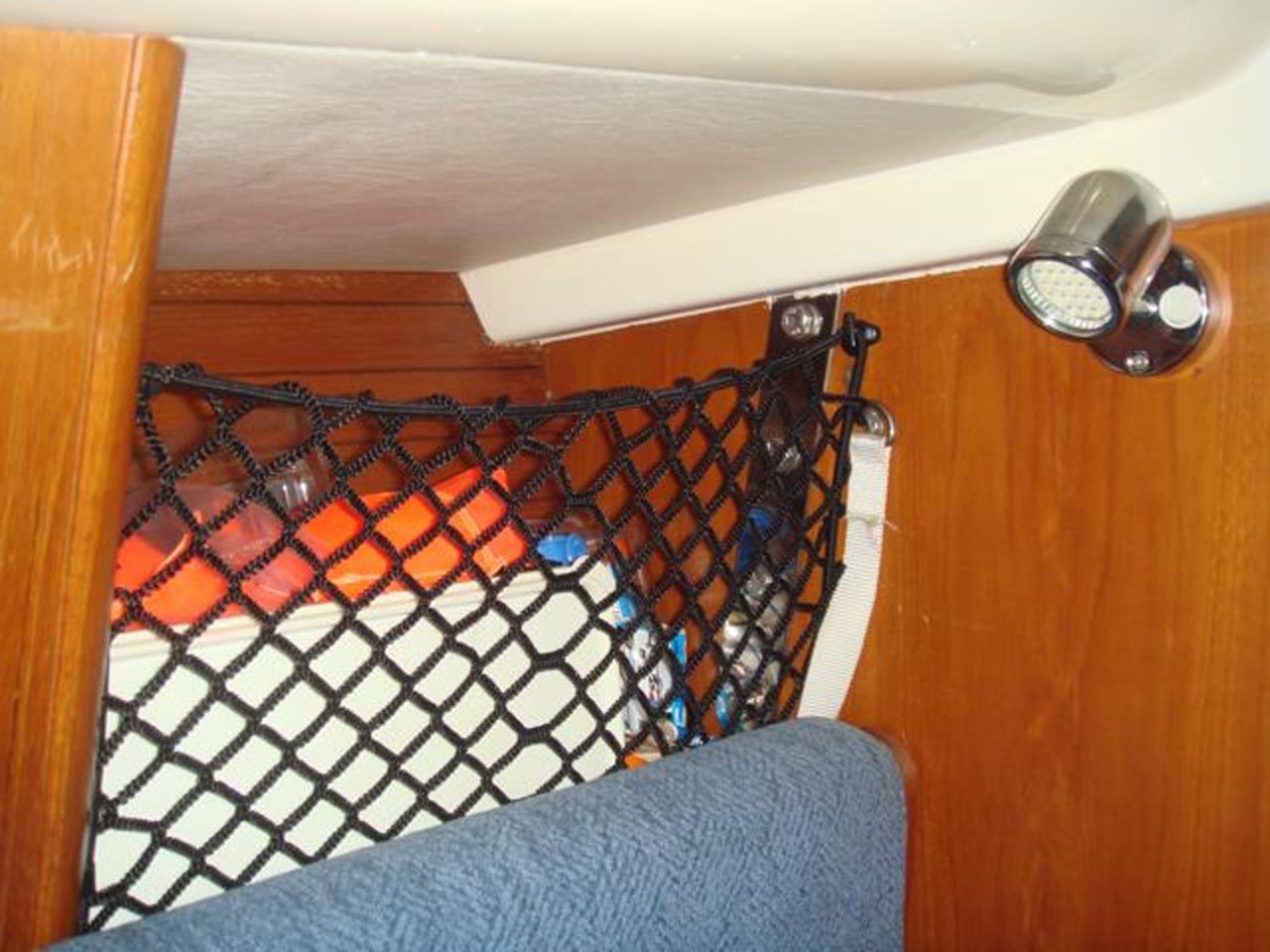 Bespoke elastic net to create extra storage space on a boat.