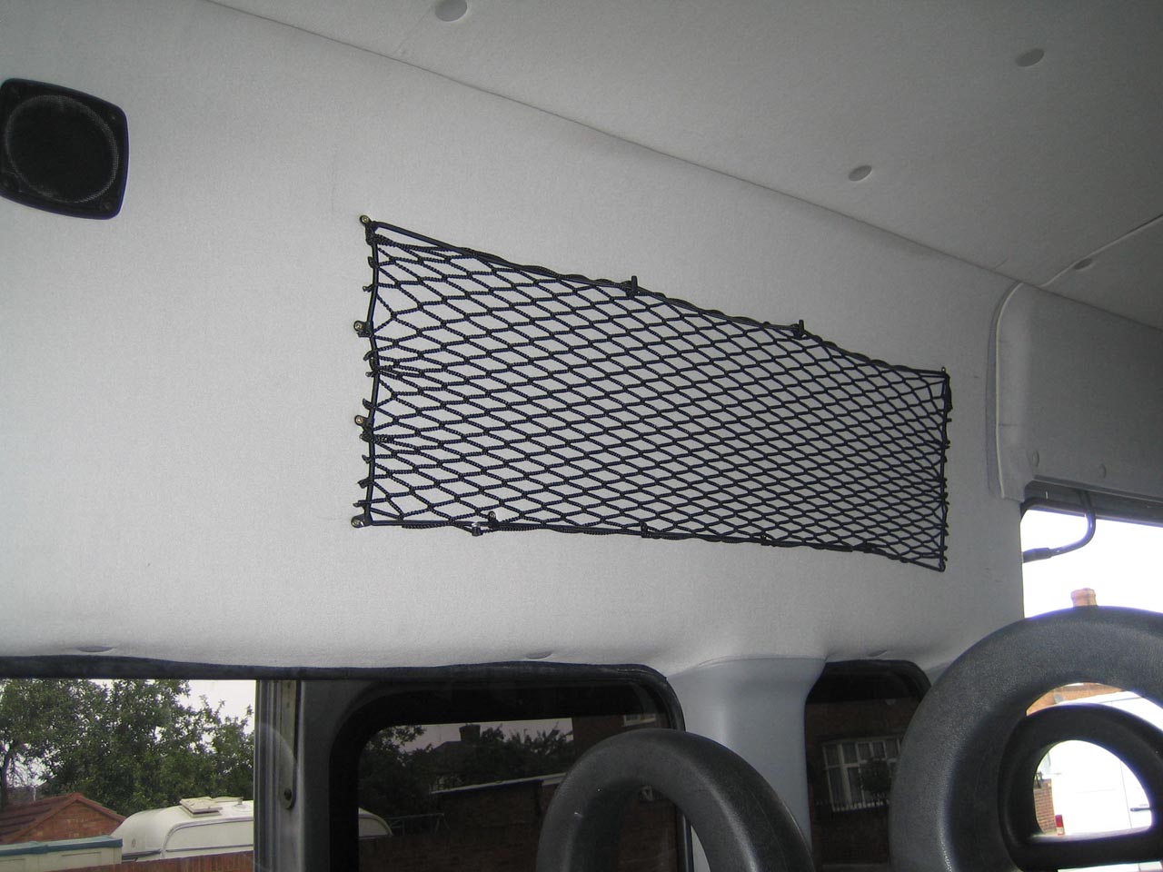 Bespoke elastic net to create storage space on the inside of a van