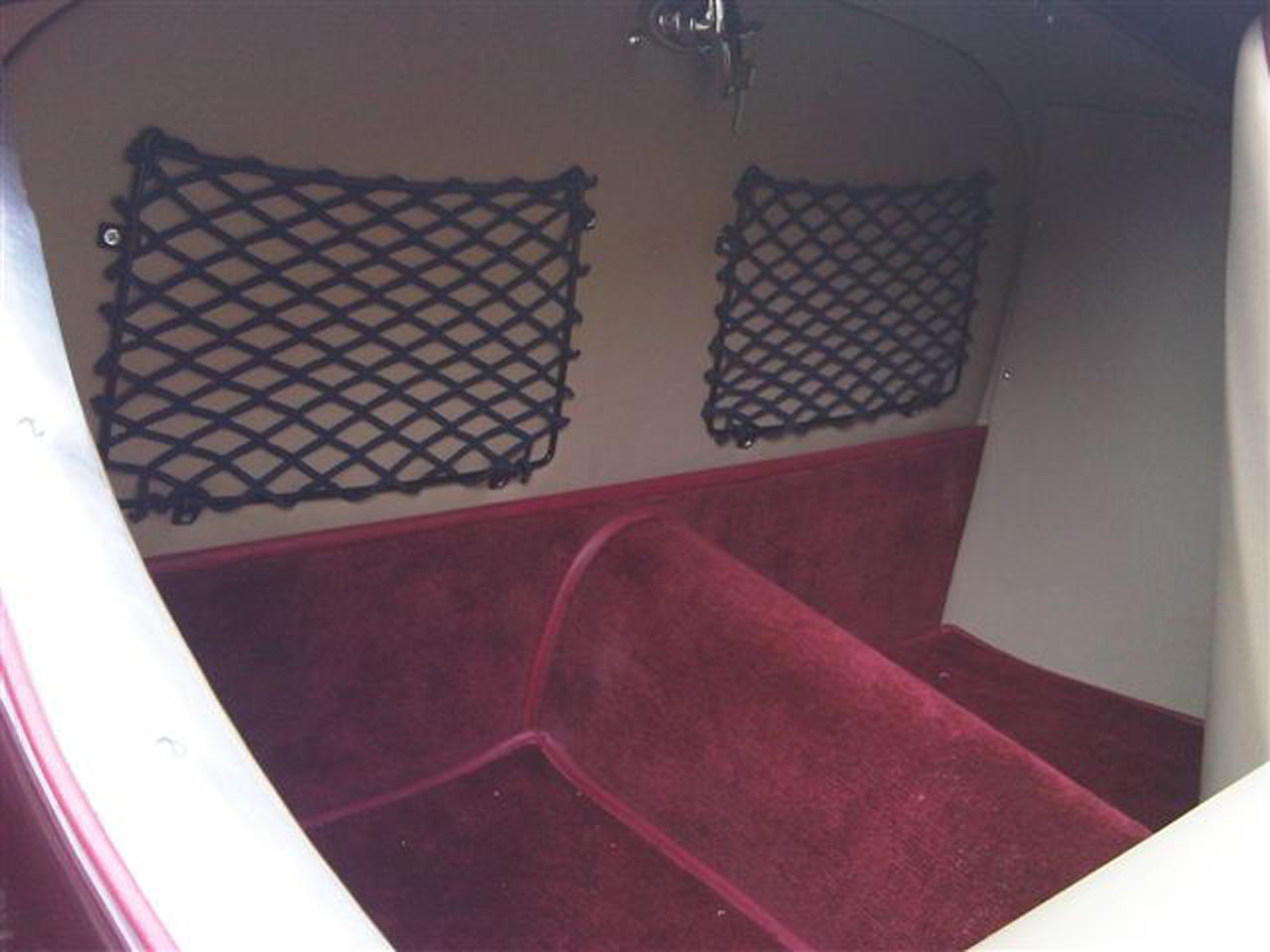 Frame elastic nets custom-made for the interior of a classic car.