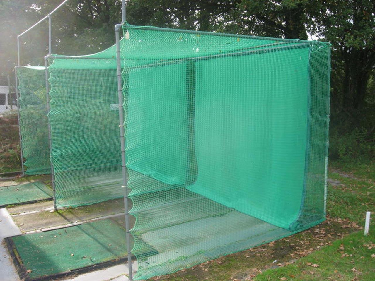 Custom-made golf practice enclosure net with additional archery grade baffle net.