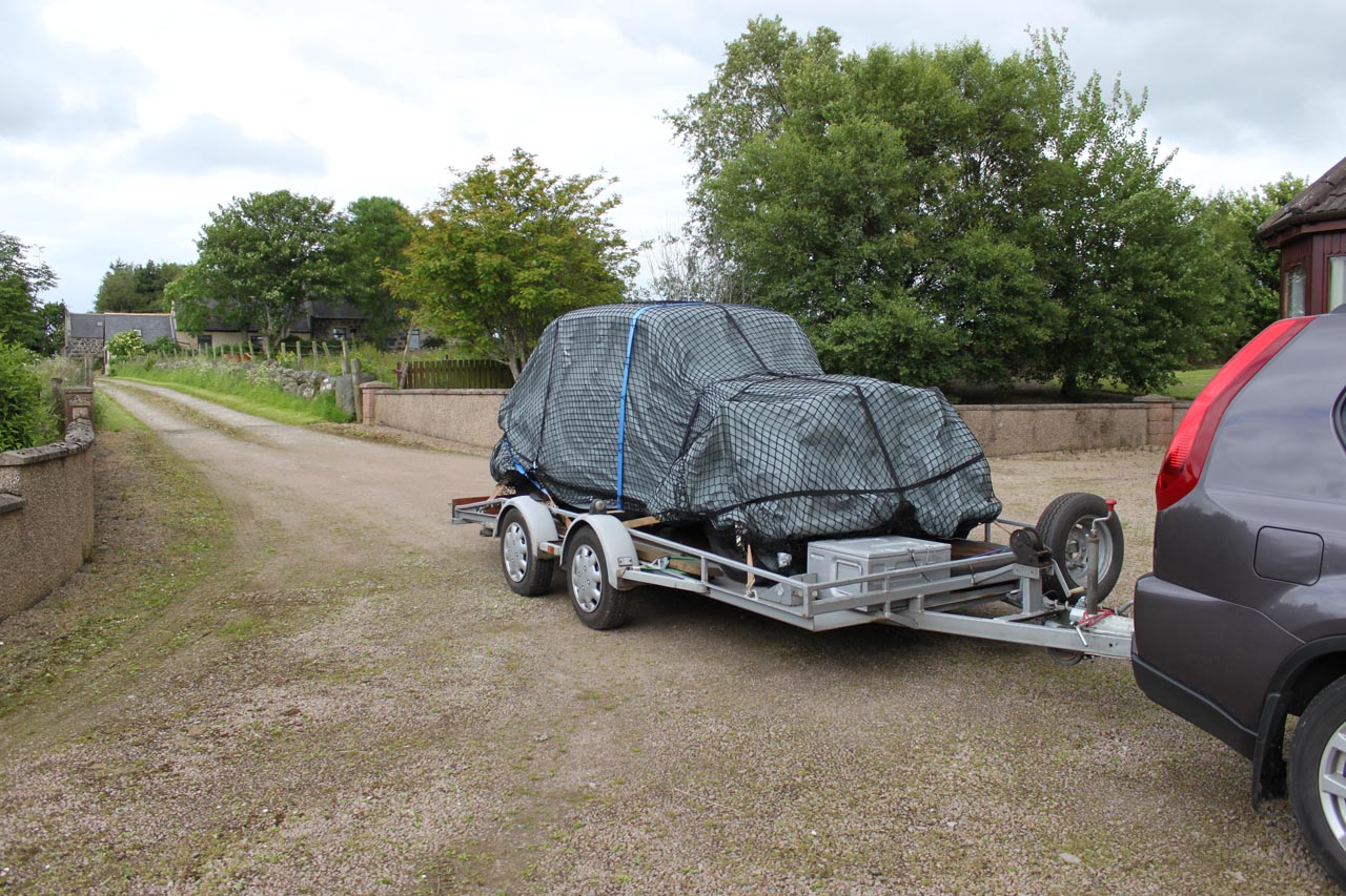 Bespoke load control net to cover a car on a trailer
