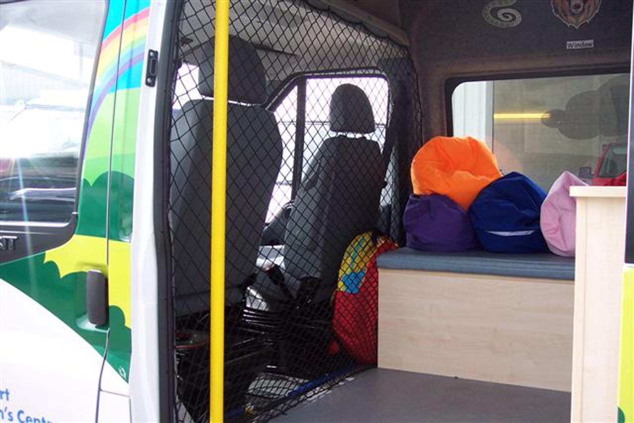 Bespoke cargo net to act as a load control barrier between the seats and the back of the van