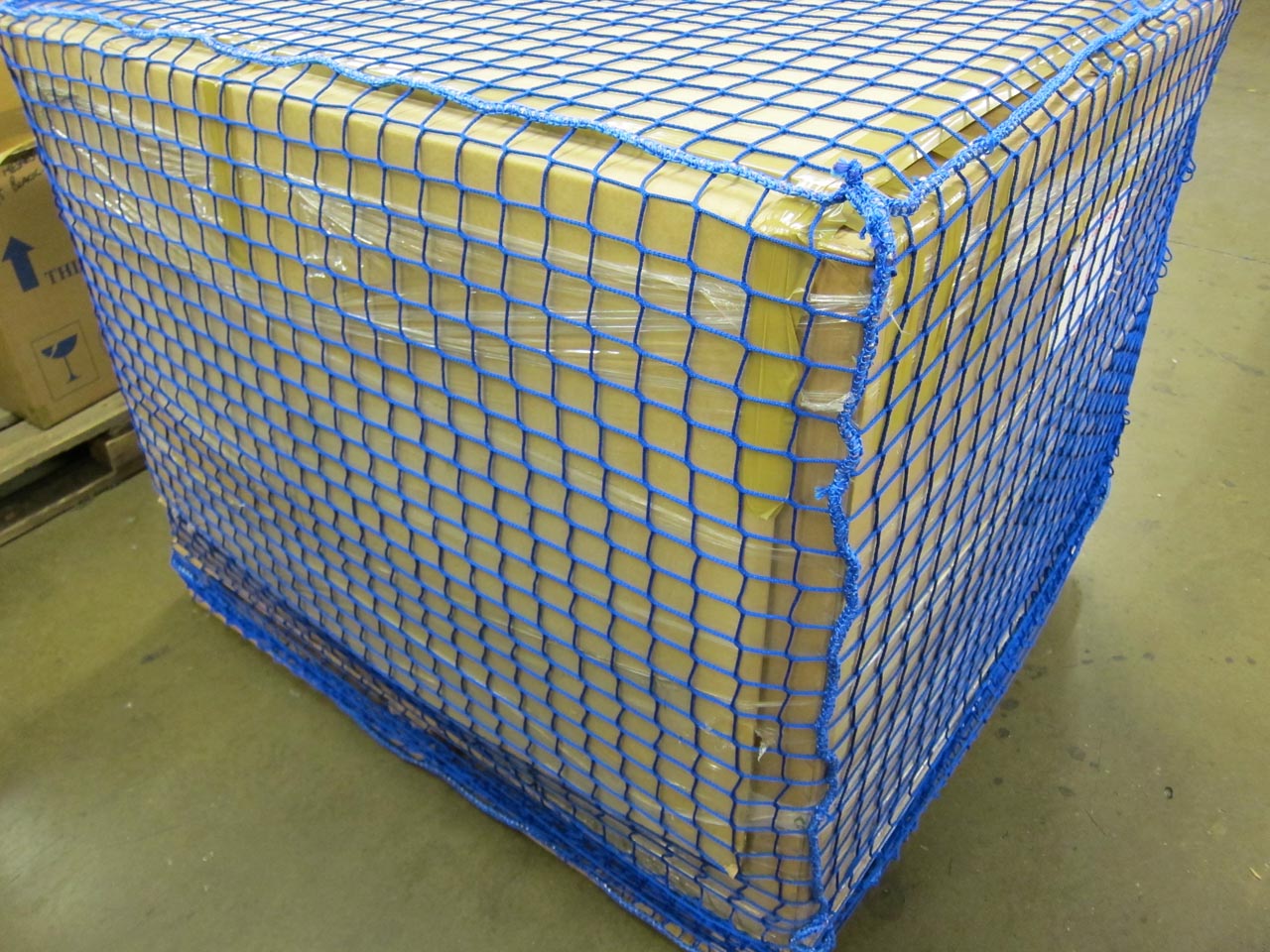 Close-up of a blue pallet cover net.
