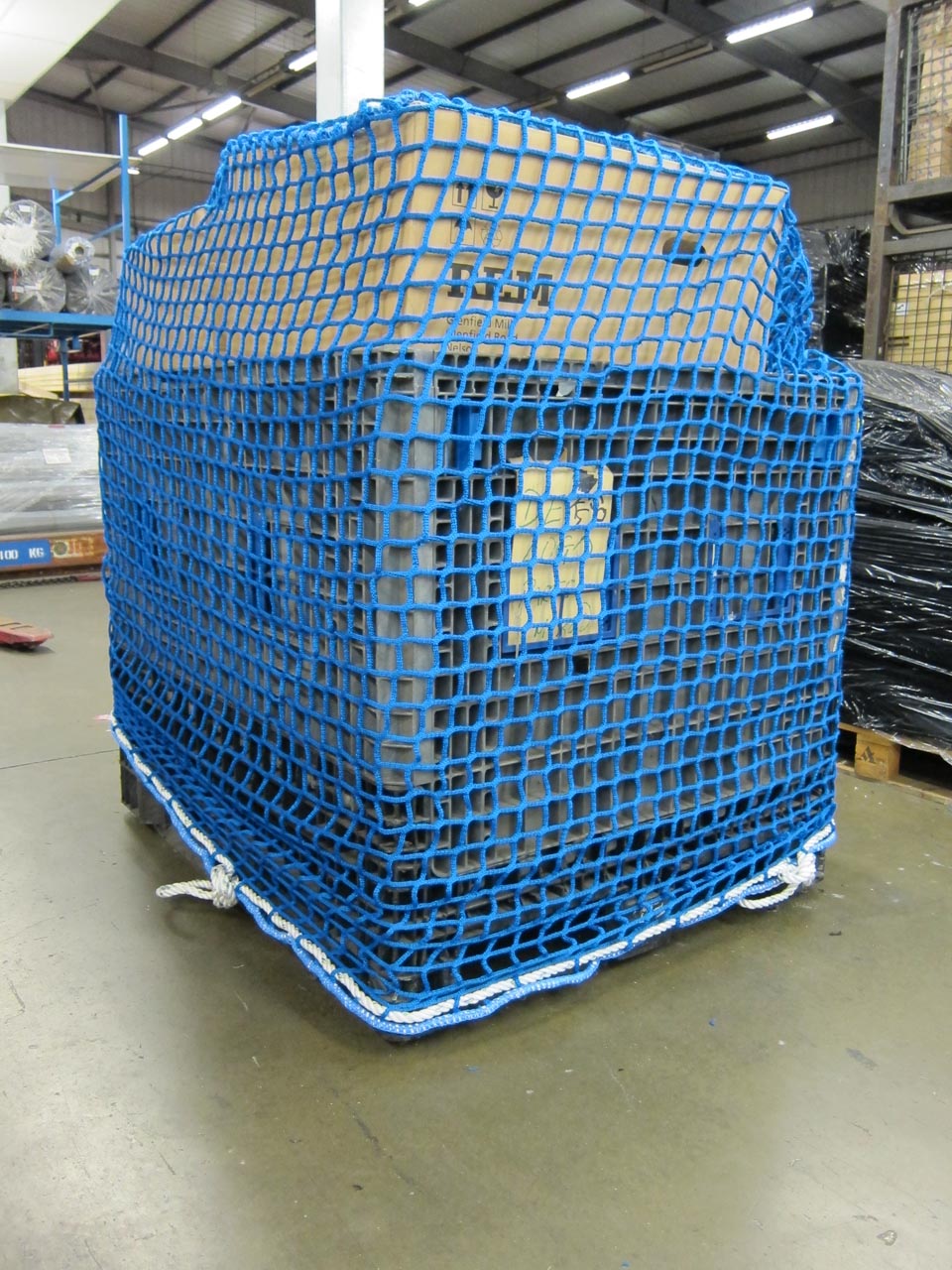 Large blue pallet cover net with border rope