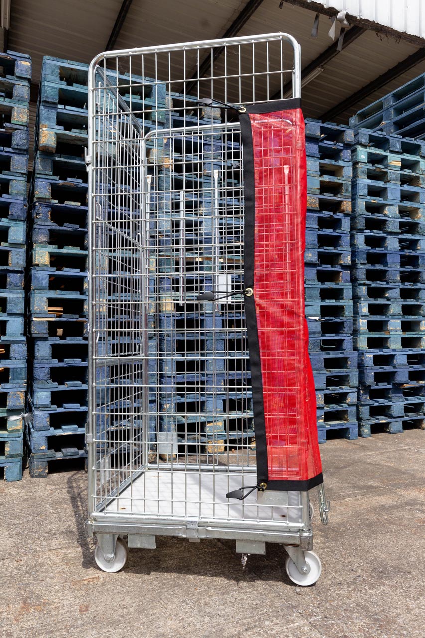Side view of bespoke red mesh roll cage cover.