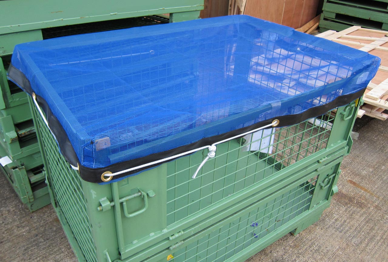 Blue mesh stillage cover with bungee cord.
