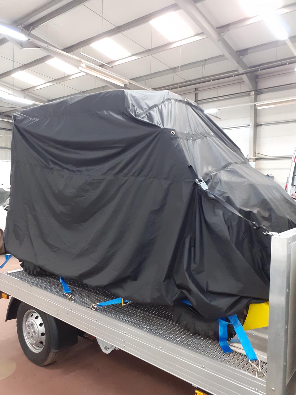 Bespoke load control cover for a car on the back of a truck