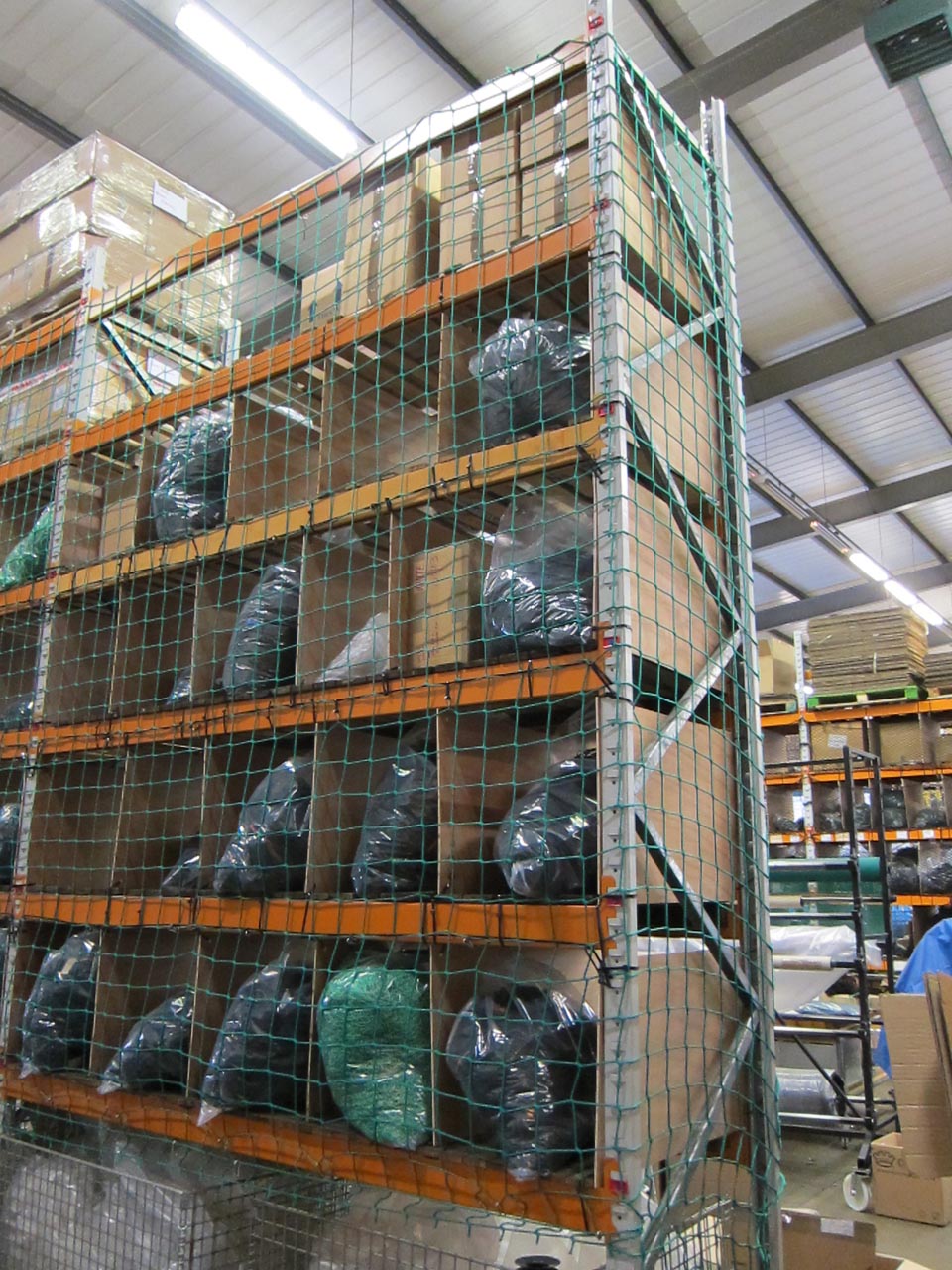 Cargo nets for warehouse racking.
