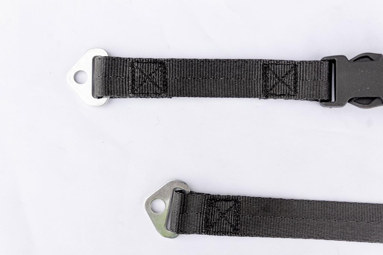 Close-up of anchor plates and side release buckle on a custom-made webbing strap.